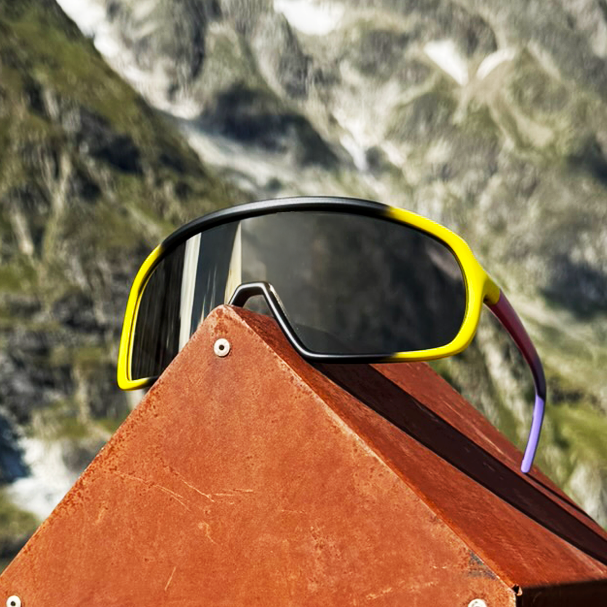E12 sunglasses displayed outdoors with bold gradient design, impact-resistant lenses for active lifestyles.