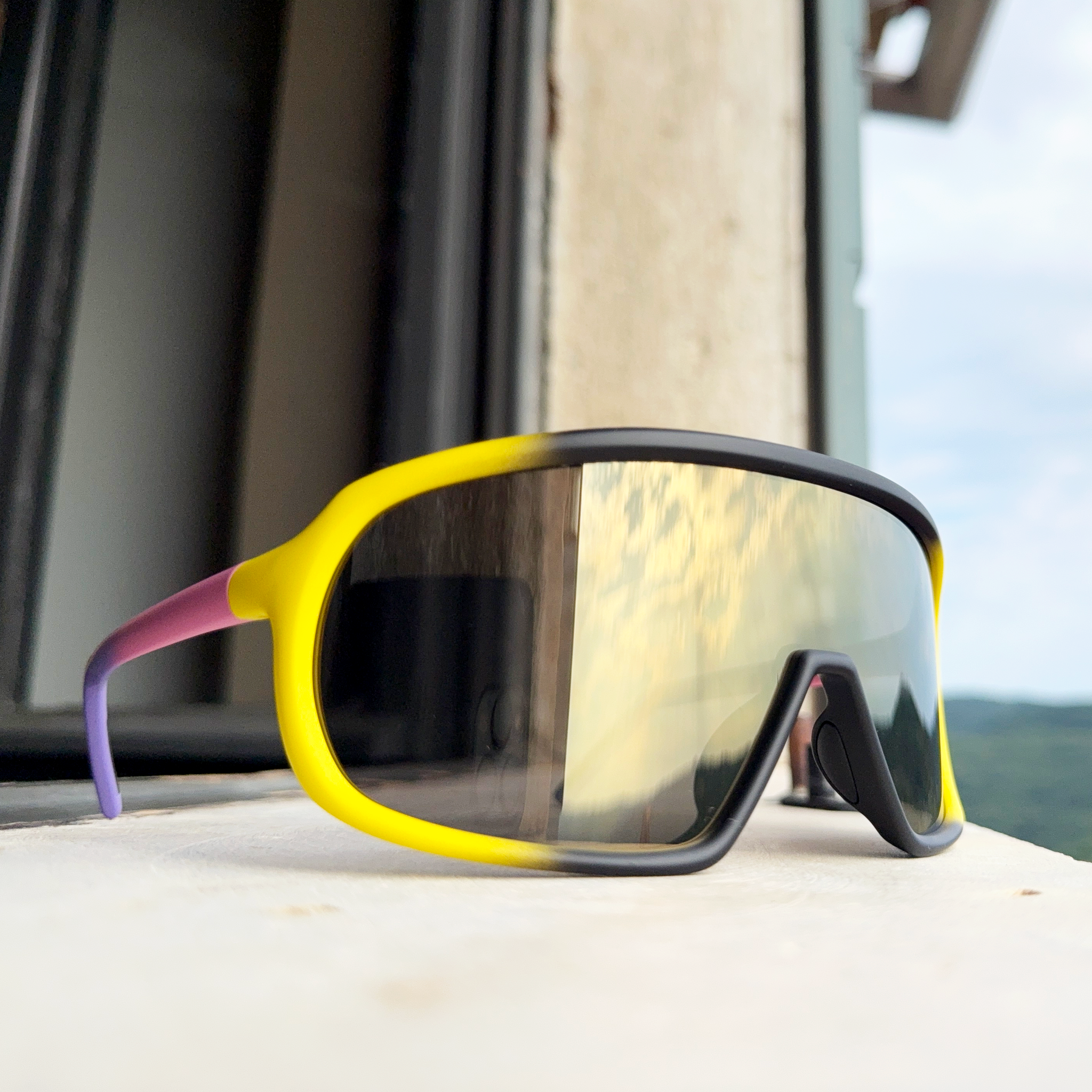 E12 precise impact-resistant sunglasses worn in an urban street setting, blending performance and lifestyle style.