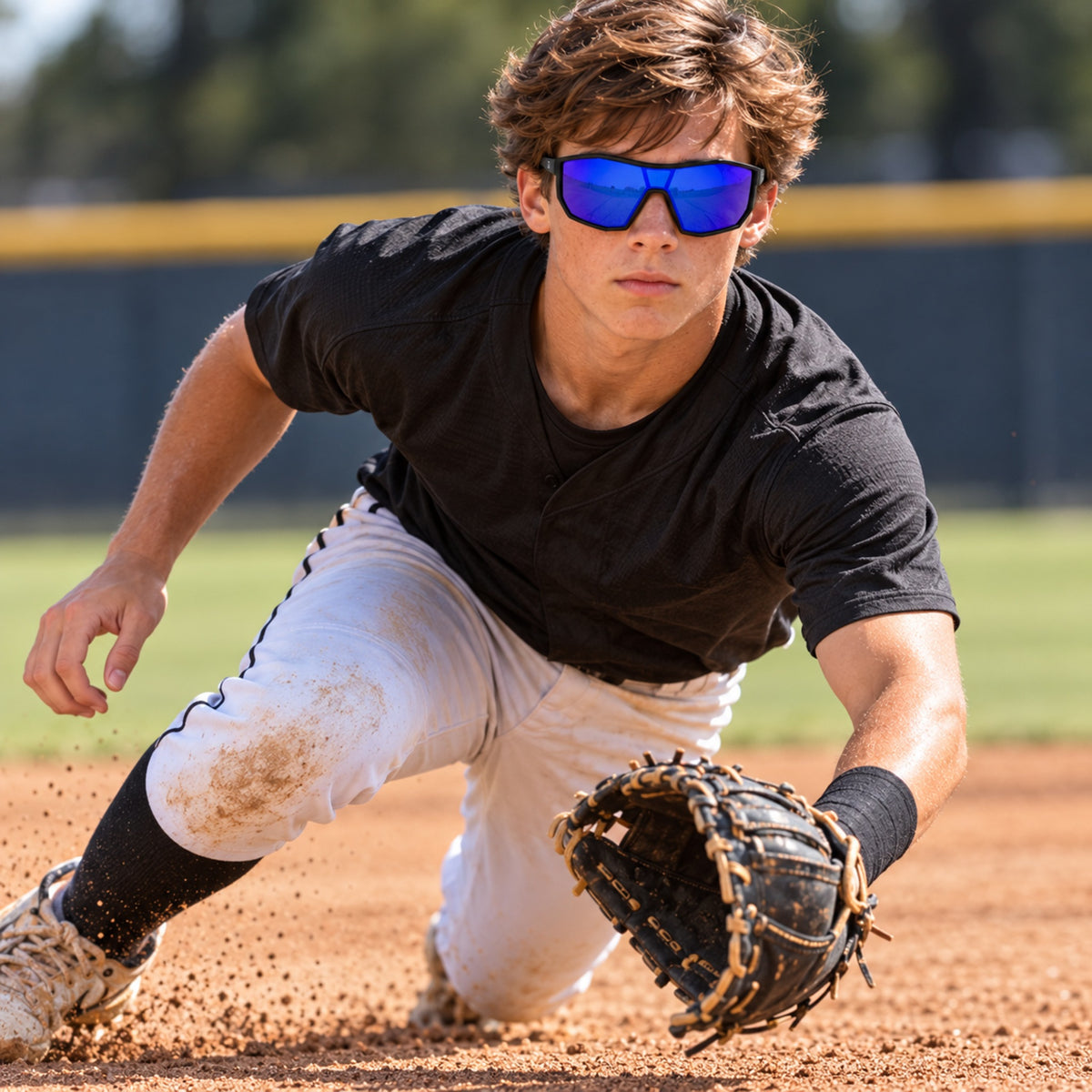 Baseball infielder wearing E3 Optics Pulse sunglasses while fielding a ground ball.