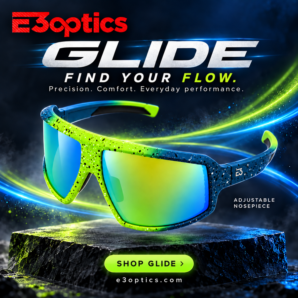 E3optics Glide sports sunglasses with a bright neon green and black speckled frame and mirrored blue-to-yellow lenses, displayed on a dark textured pedestal with glowing graphic effects and the text 'GLIDE' and 'FIND YOUR FLOW.'.