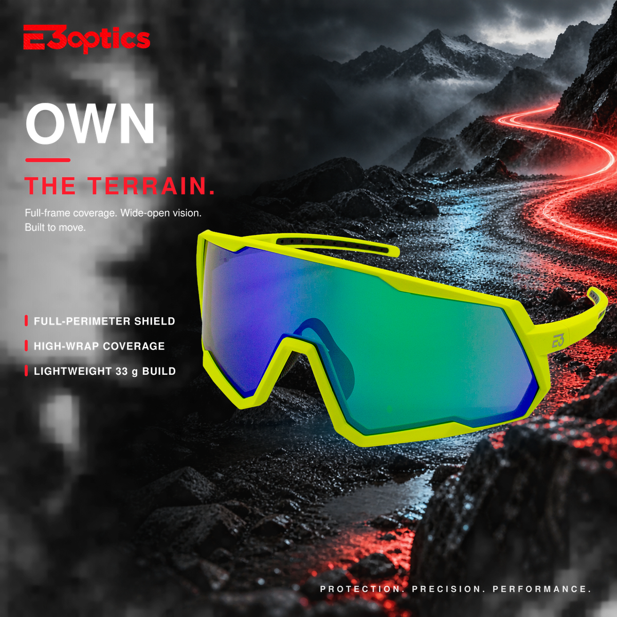 E3optics full-frame shield sunglasses with a bright neon yellow frame and a green-to-blue mirrored lens, set against a dramatic mountain road background with red light trails and promotional text.