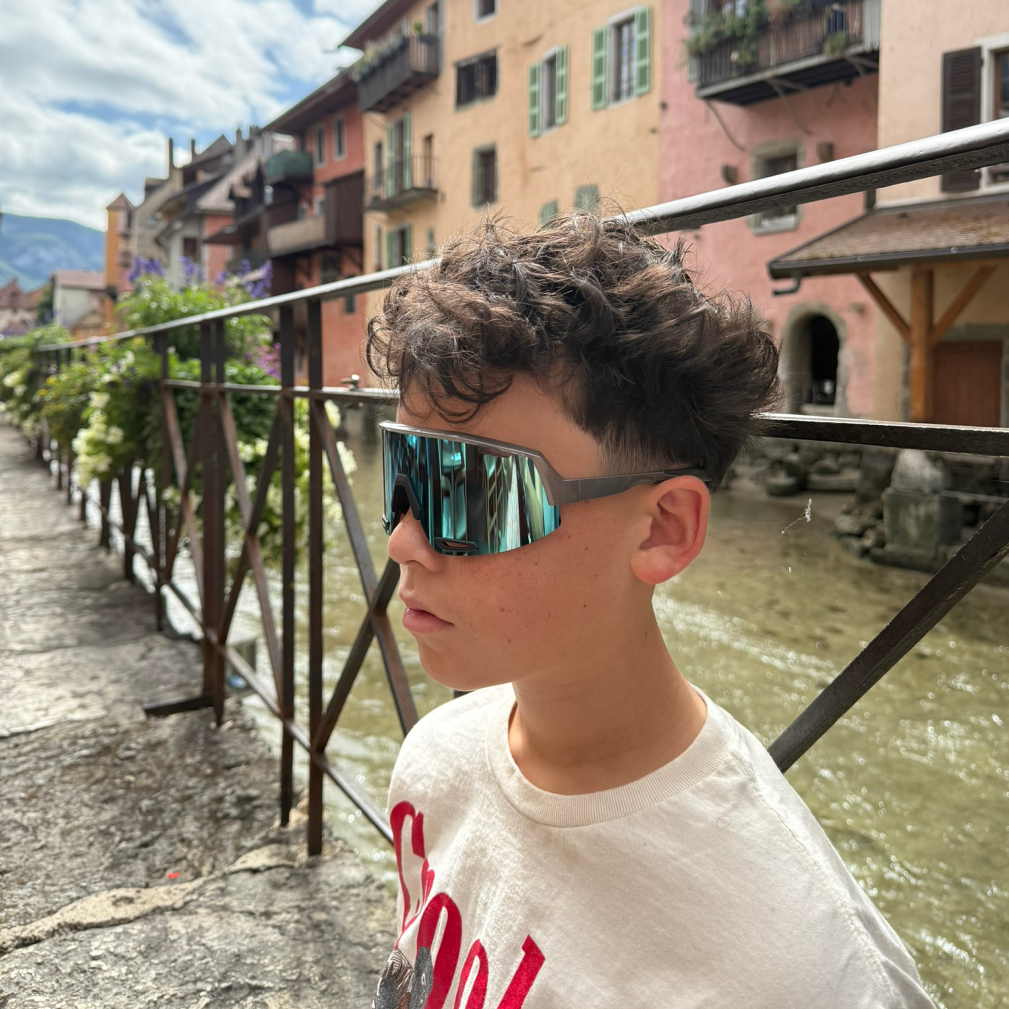 Youth wearing E3 Optics E8 Series sunglasses – unisex blue mirror performance shades for everyday and sports.
