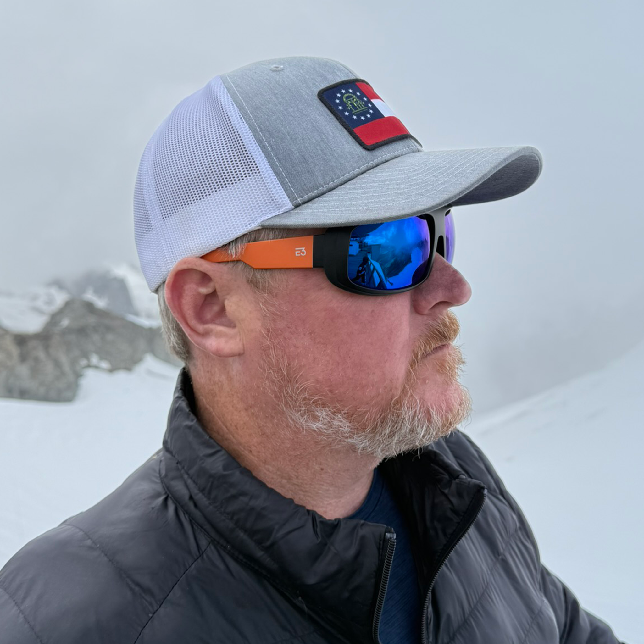 Man wearing E3 Optics E15 polarized sunglasses on Mont Blanc – sport sunglasses for hiking and climbing.